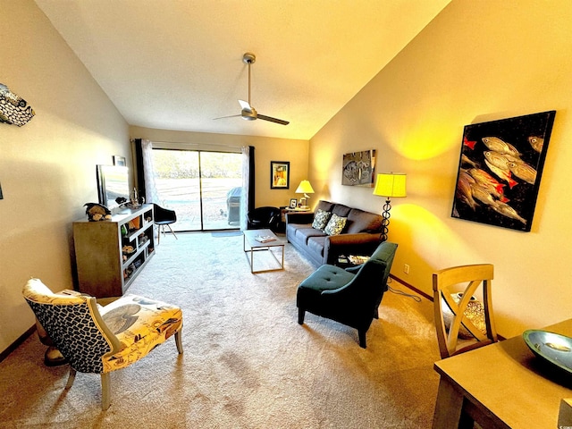 living room featuring carpet floors, ceiling fan, and vaulted ceiling