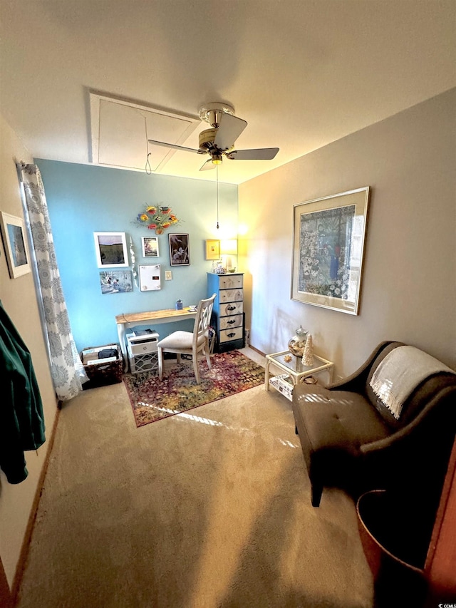 carpeted office featuring ceiling fan