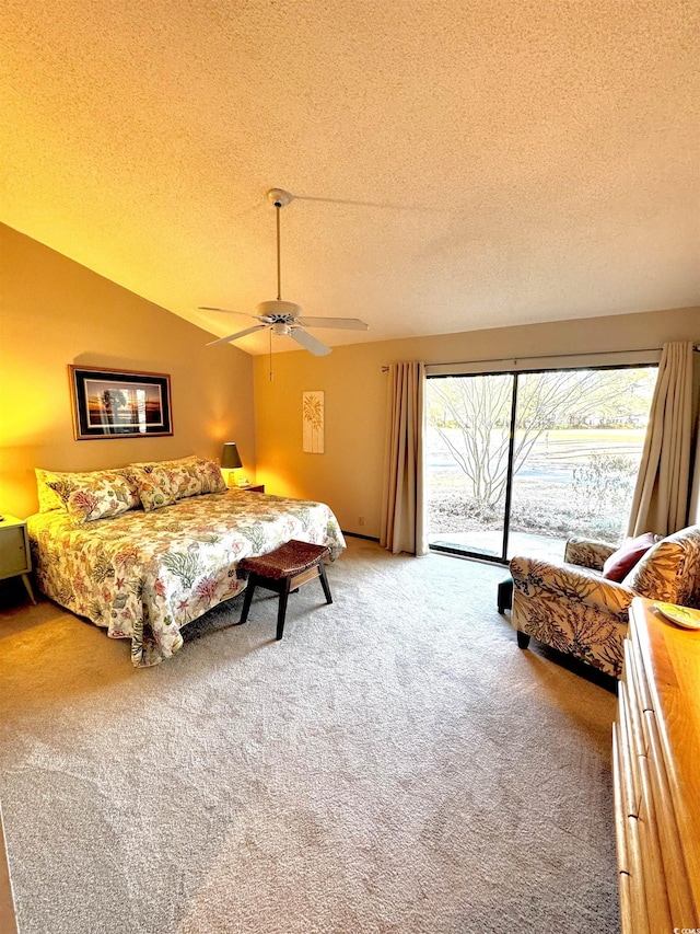 bedroom with vaulted ceiling, a textured ceiling, access to outside, ceiling fan, and carpet