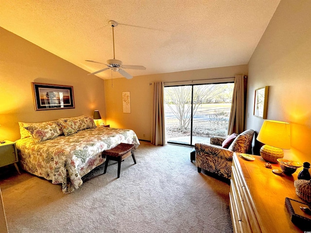 carpeted bedroom with ceiling fan, lofted ceiling, a textured ceiling, and access to outside