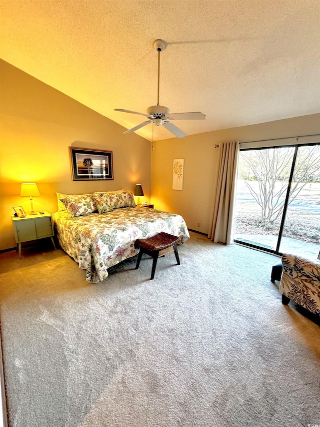 bedroom with lofted ceiling, a textured ceiling, ceiling fan, access to exterior, and carpet