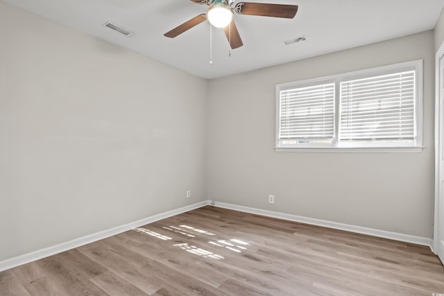 unfurnished room with ceiling fan and light wood-type flooring