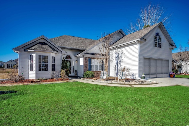 view of front of house featuring a garage and a front lawn