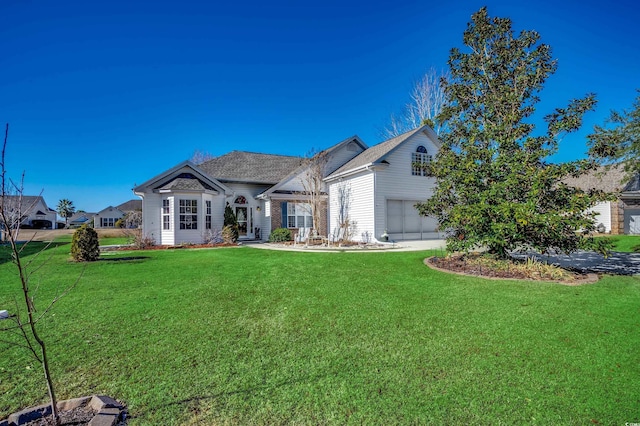 view of front of home featuring a garage and a front yard