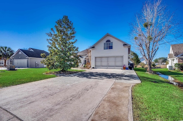 1579 Southwood Dr, Surfside Beach, SC 29575 - traditional-style house with an attached garage, driveway, and a front yard
