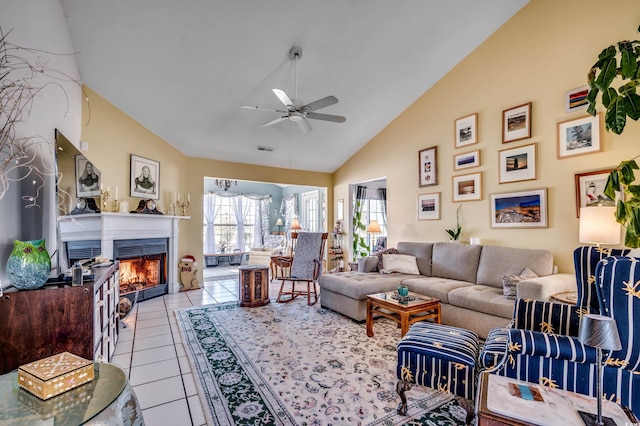 1579 Southwood Dr, Surfside Beach, SC 29575 - living room featuring a ceiling fan, a glass covered fireplace, light tile patterned flooring, and high vaulted ceiling