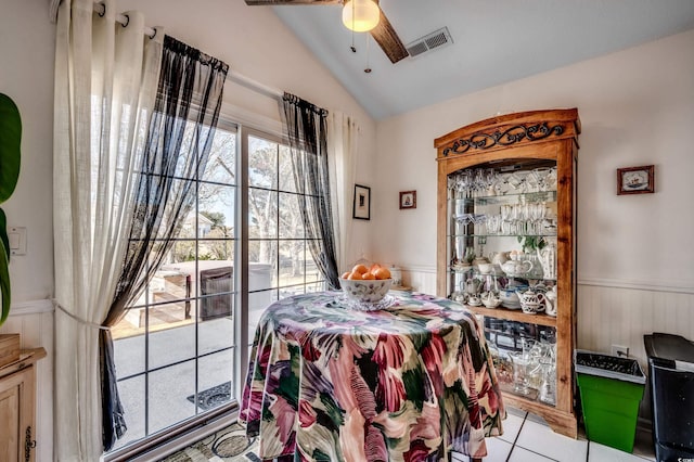 1579 Southwood Dr, Surfside Beach, SC 29575 - bedroom featuring lofted ceiling, wainscoting, tile patterned floors, and ceiling fan