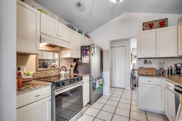 1579 Southwood Dr, Surfside Beach, SC 29575 - kitchen featuring range with electric stovetop, lofted ceiling, freestanding refrigerator, under cabinet range hood, and light tile patterned flooring