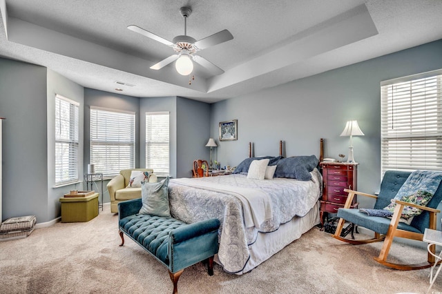 1579 Southwood Dr, Surfside Beach, SC 29575 - bedroom featuring carpet flooring, a raised ceiling, a textured ceiling, ceiling fan, and baseboards