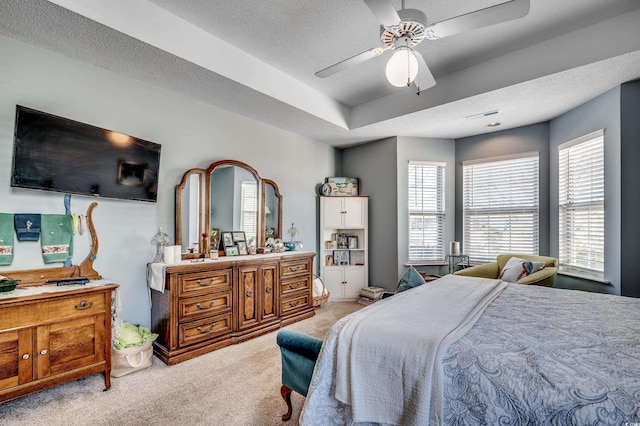 1579 Southwood Dr, Surfside Beach, SC 29575 - bedroom with carpet, a textured ceiling, and a tray ceiling