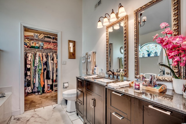 1579 Southwood Dr, Surfside Beach, SC 29575 - full bath featuring marble finish flooring, toilet, vanity, and a spacious closet