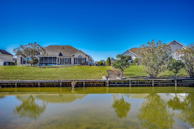 1579 Southwood Dr, Surfside Beach, SC 29575 - dock area featuring a water view and a lawn