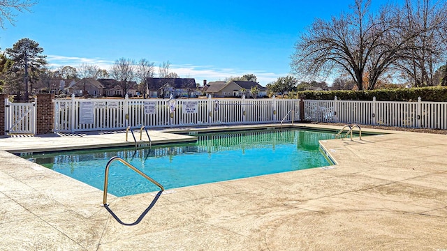 1579 Southwood Dr, Surfside Beach, SC 29575 - community pool featuring fence, a patio, and a residential view