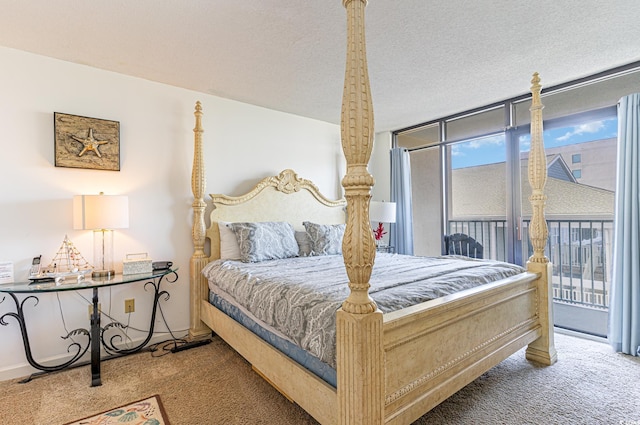 bedroom featuring floor to ceiling windows, carpet flooring, a textured ceiling, and access to outside