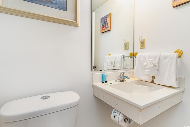 bathroom with sink and toilet