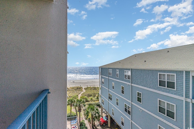 balcony with a view of the beach and a water view