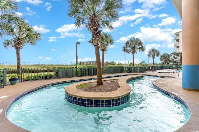 view of swimming pool featuring a patio area