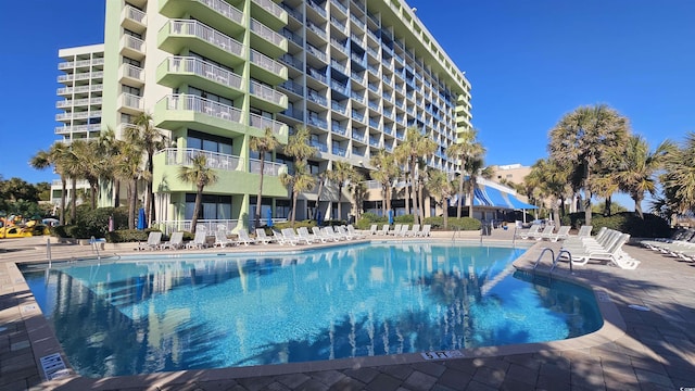 view of swimming pool featuring a patio area