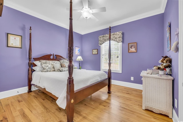 bedroom with light hardwood / wood-style flooring, ornamental molding, and ceiling fan