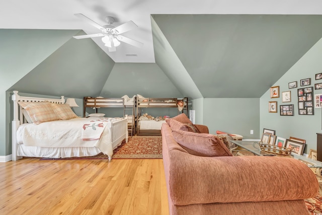 bedroom featuring ceiling fan, vaulted ceiling, and light hardwood / wood-style flooring