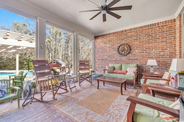 sunroom featuring ceiling fan