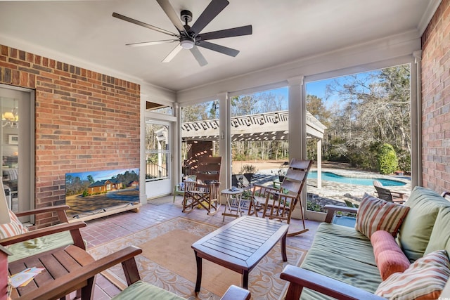 sunroom / solarium with ceiling fan