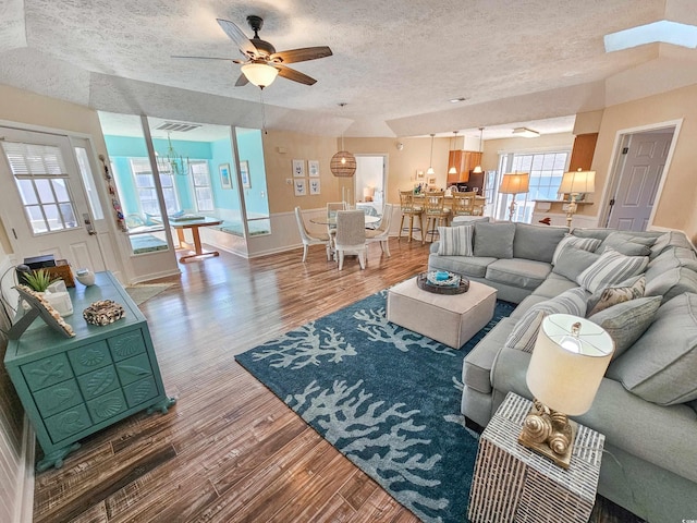 299 Lake Arrowhead Rd, Myrtle Beach, SC 29572 - living room featuring a textured ceiling, wood finished floors, and a ceiling fan