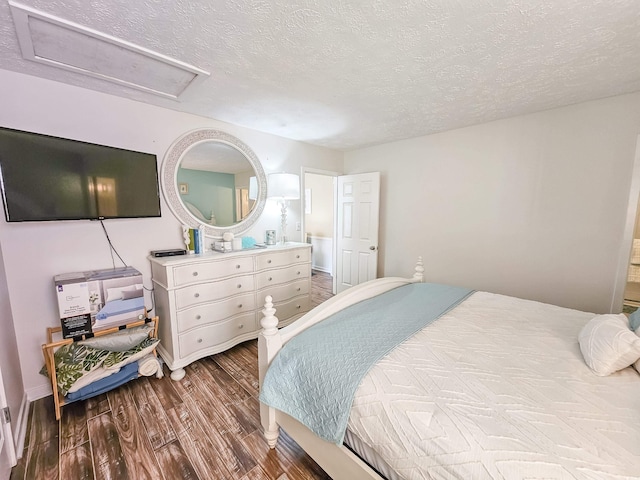 299 Lake Arrowhead Rd, Myrtle Beach, SC 29572 - bedroom featuring attic access, dark wood-style flooring, and a textured ceiling