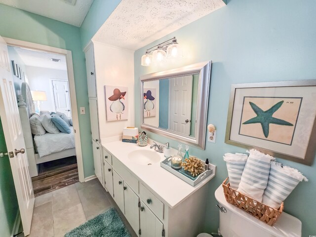 299 Lake Arrowhead Rd, Myrtle Beach, SC 29572 - bathroom featuring vanity, tile patterned floors, and ensuite bathroom