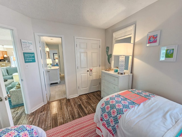 299 Lake Arrowhead Rd, Myrtle Beach, SC 29572 - bedroom featuring dark wood-type flooring and a textured ceiling