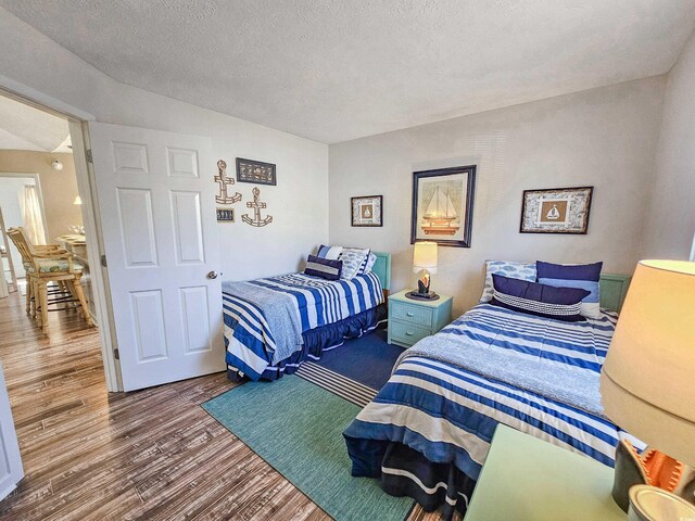 299 Lake Arrowhead Rd, Myrtle Beach, SC 29572 - bedroom featuring wood finished floors and a textured ceiling