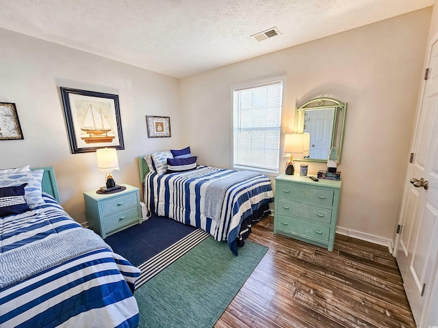 299 Lake Arrowhead Rd, Myrtle Beach, SC 29572 - bedroom with dark wood finished floors and a textured ceiling