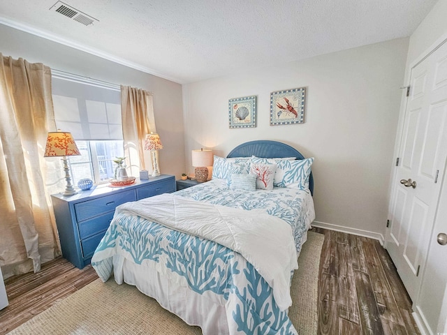 299 Lake Arrowhead Rd, Myrtle Beach, SC 29572 - bedroom with wood finished floors and a textured ceiling