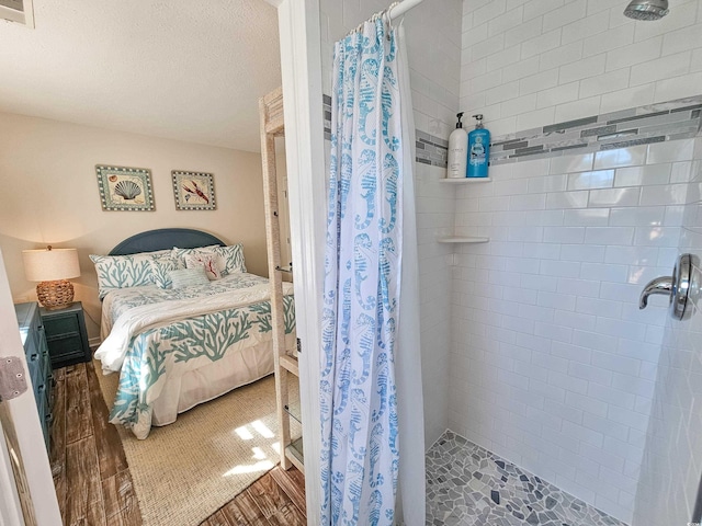 299 Lake Arrowhead Rd, Myrtle Beach, SC 29572 - bedroom featuring wood finished floors and a textured ceiling