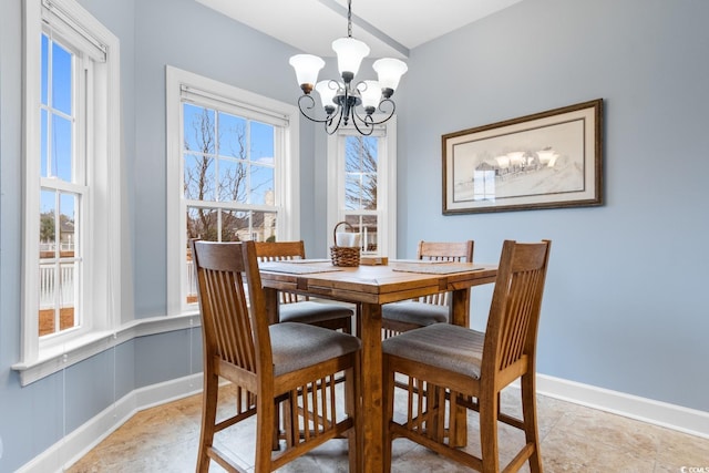 dining area featuring a chandelier