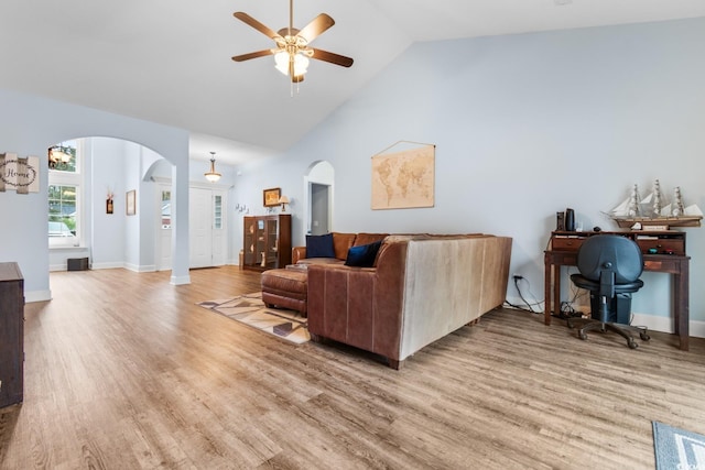 living room featuring ceiling fan, high vaulted ceiling, and light hardwood / wood-style flooring