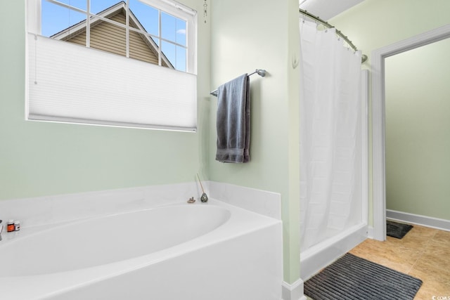 bathroom with tile patterned flooring and independent shower and bath