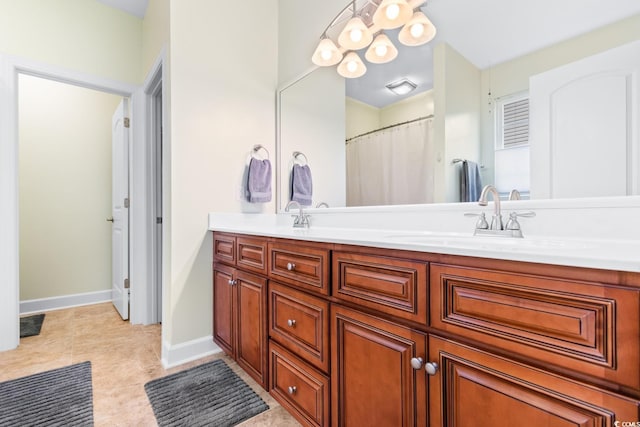 bathroom with tile patterned flooring and vanity