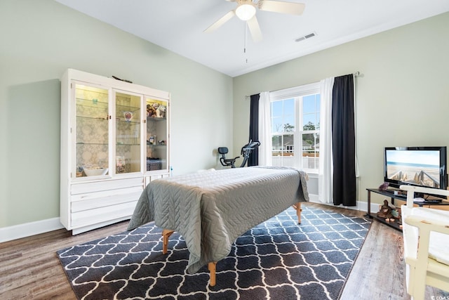 bedroom featuring hardwood / wood-style floors and ceiling fan