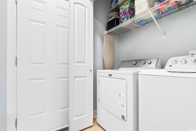 laundry room with washer and clothes dryer