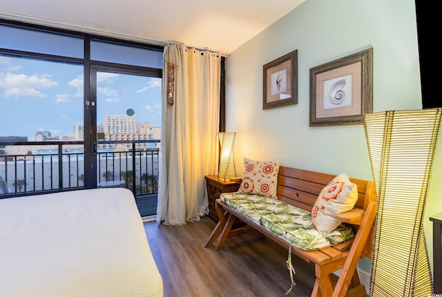 1501 S Ocean Blvd Unit 811, Myrtle Beach, SC 29577 - bedroom featuring a view of city, access to outside, a wall of windows, and wood finished floors