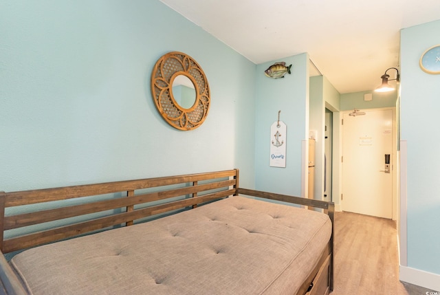 bedroom with light hardwood / wood-style floors