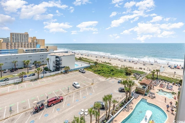 bird's eye view featuring a view of the beach and a water view