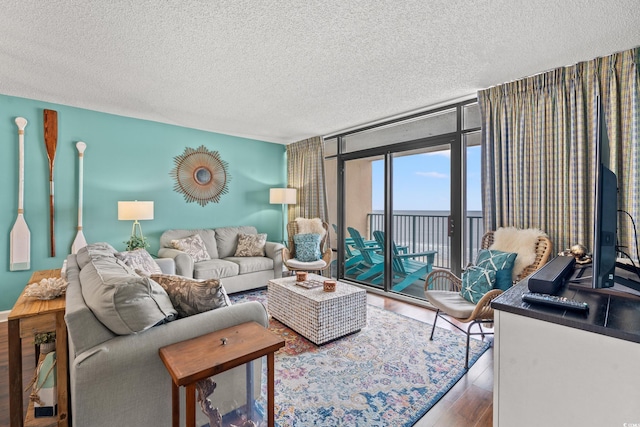 501 S Ocean Blvd Unit 505, North Myrtle Beach, SC 29582 - living area with wood finished floors and a textured ceiling