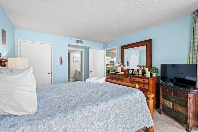 501 S Ocean Blvd Unit 505, North Myrtle Beach, SC 29582 - bedroom with a textured ceiling and carpet flooring