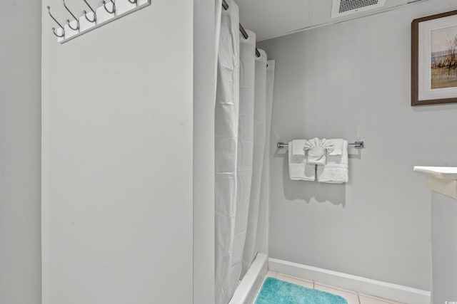 501 S Ocean Blvd Unit 505, North Myrtle Beach, SC 29582 - full bathroom featuring tile patterned flooring and a shower with curtain