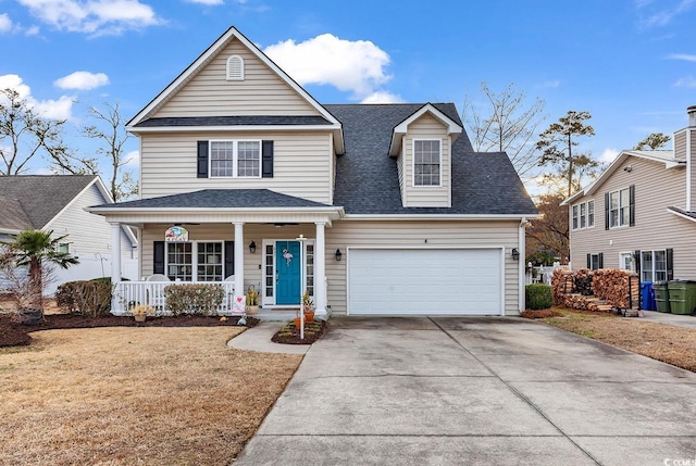 view of front property with a porch, a garage, and a front lawn