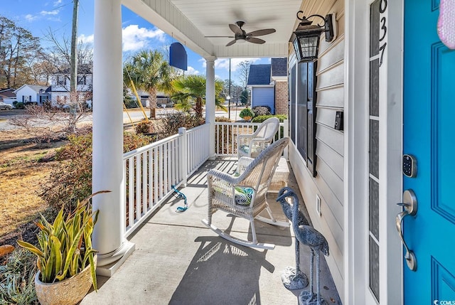 balcony with ceiling fan and covered porch