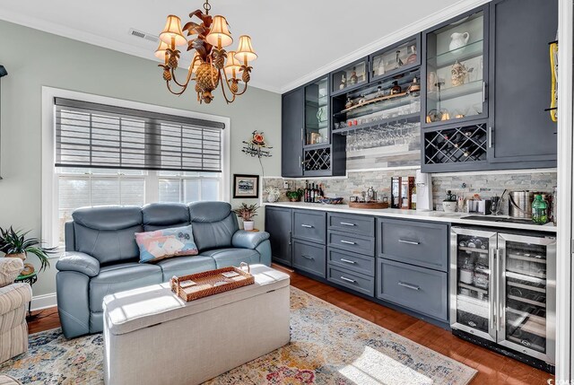 637 Sparrow Dr, Surfside Beach, SC 29575 - bar with backsplash, crown molding, visible vents, and wine cooler
