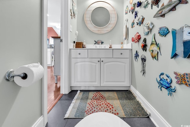 637 Sparrow Dr, Surfside Beach, SC 29575 - bathroom featuring baseboards and vanity